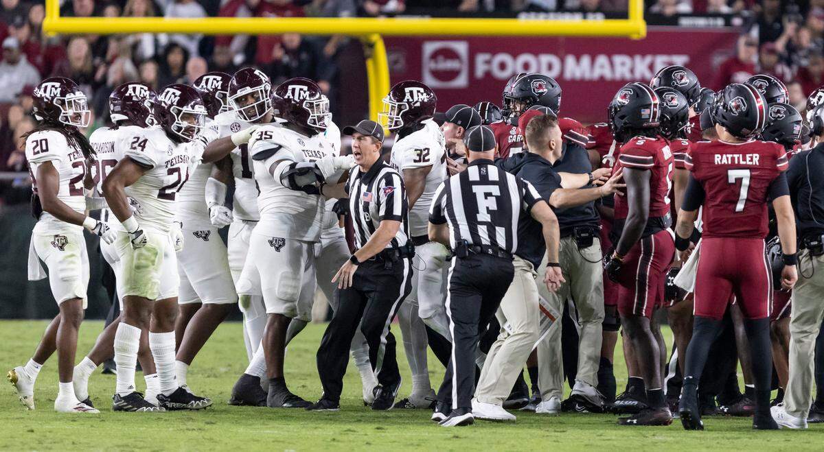 Members of the South Carolina Gamecocks and Texas A&M Aggies are separated during a brief altercation at Williams-Brice Stadium in Columbia, SC on Saturday, Oct. 22, 2022.