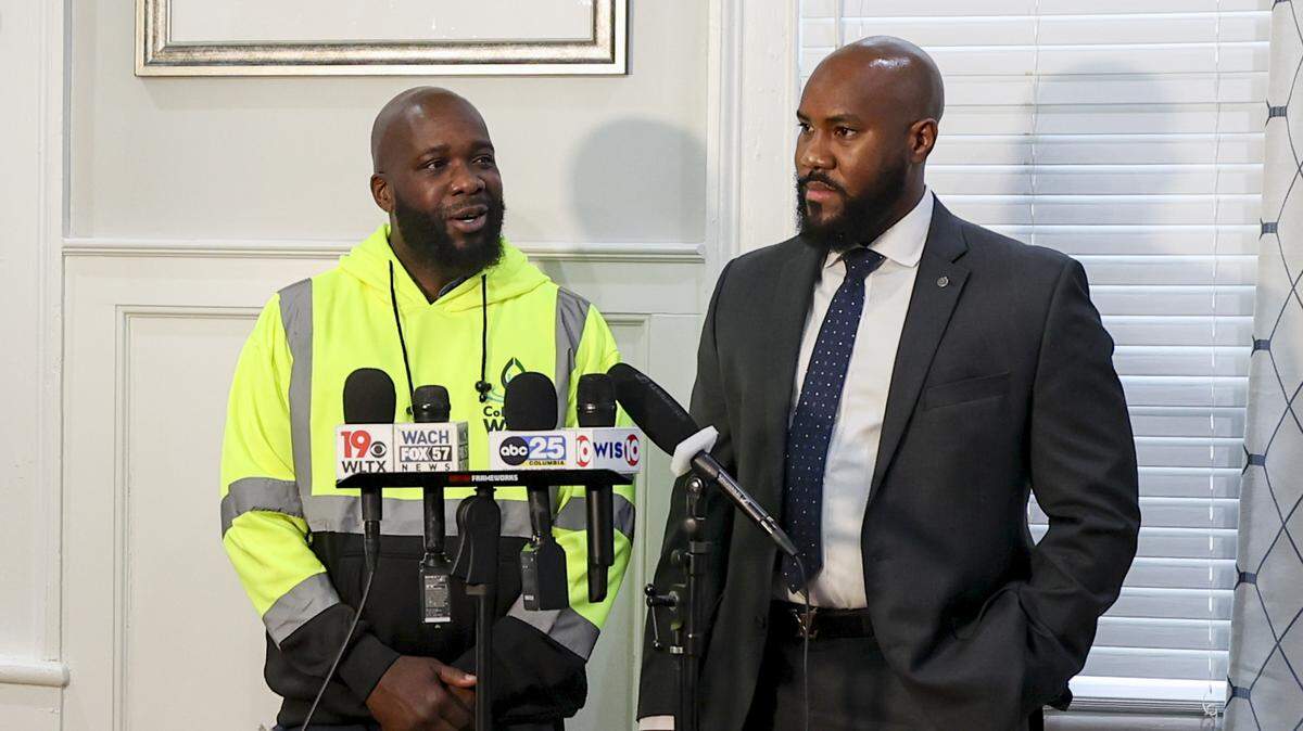 Jarvis McKenzie stands with his attorney,Tyler Bailey, during a press conference on Thursday, Dec. 18, 2025, at the Bailey Law Firm in Columbia. McKenzie is the victim of a hate crime with county and federal charges.
