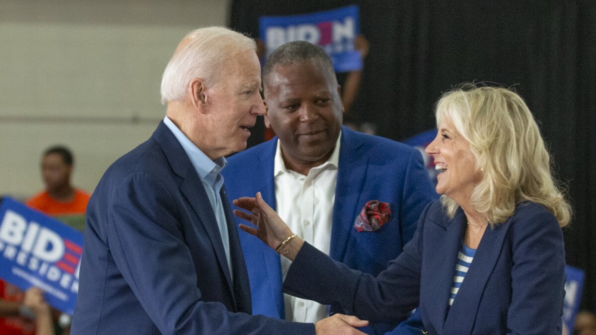 Columbia Mayor Steve Benjamin watches as Joe Biden and his wife, Jill Biden embrace before speaking to supporters during his first campaign stop in South Carolina at the Hyatt Park Community Center in Columbia. 5/4/19