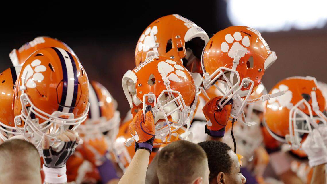 Clemson players hold up their helmets before the NCAA college football playoff championship game against Alabama Monday, Jan. 9, 2017, in Tampa, Fla. (AP Photo/Chris O’Meara)