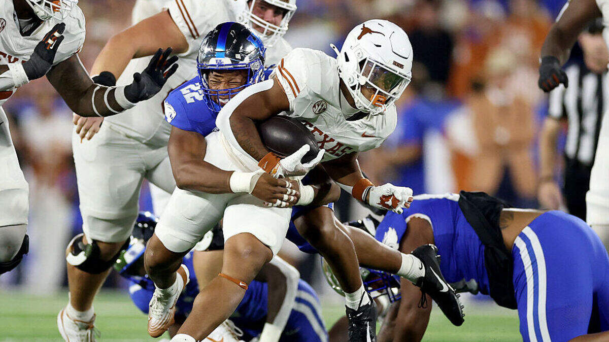 Christian Clark of the Texas Longhorns runs with the ball against the Kentucky Wildcats at Kroger Field on October 18, 2025 in Lexington, Kentucky.