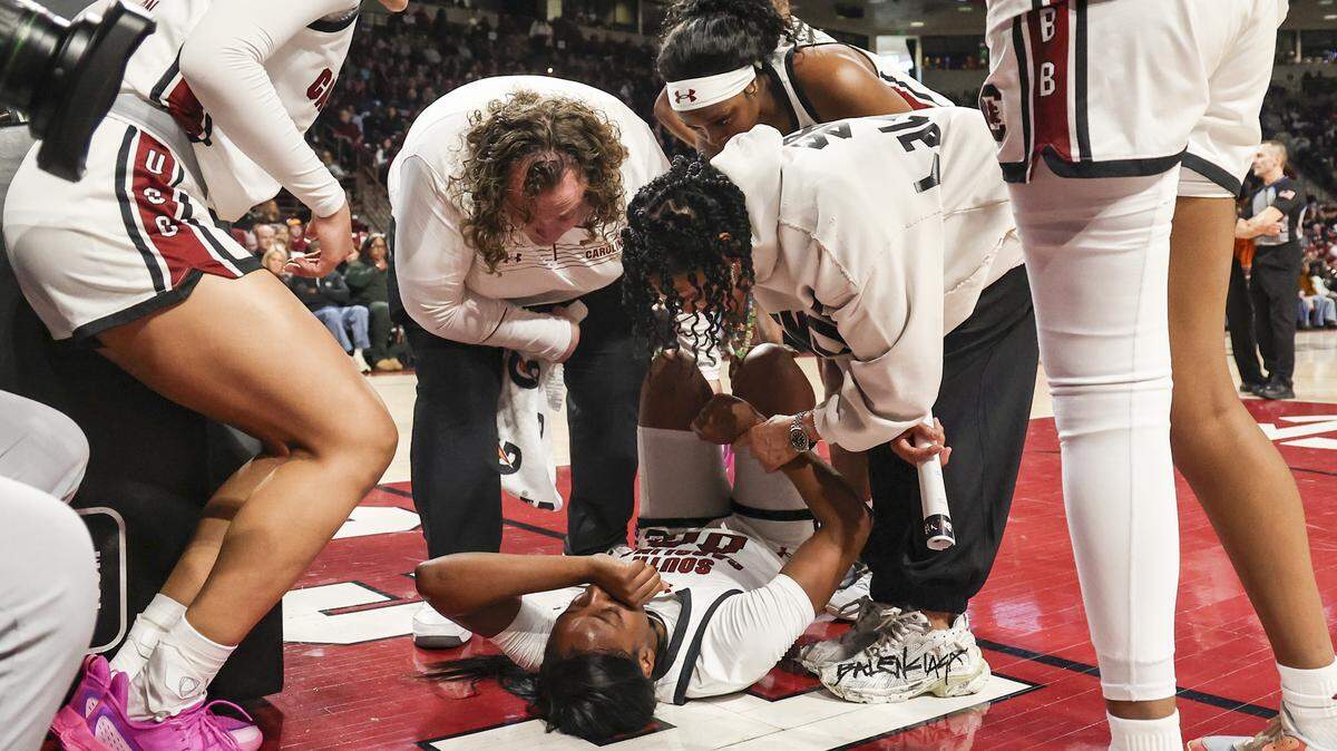 South Carolina's head coach Dawn Staley consoles Ta'Niya Latson (00) during the first half of action of their women's basketball game against Providence at Colonial Life Arena on Sunday, Dec. 28, 2025.