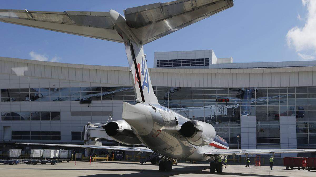 An American Airlines MD-82 parks at Terminal D at Dallas-Fort Worth International Airport in 2015.