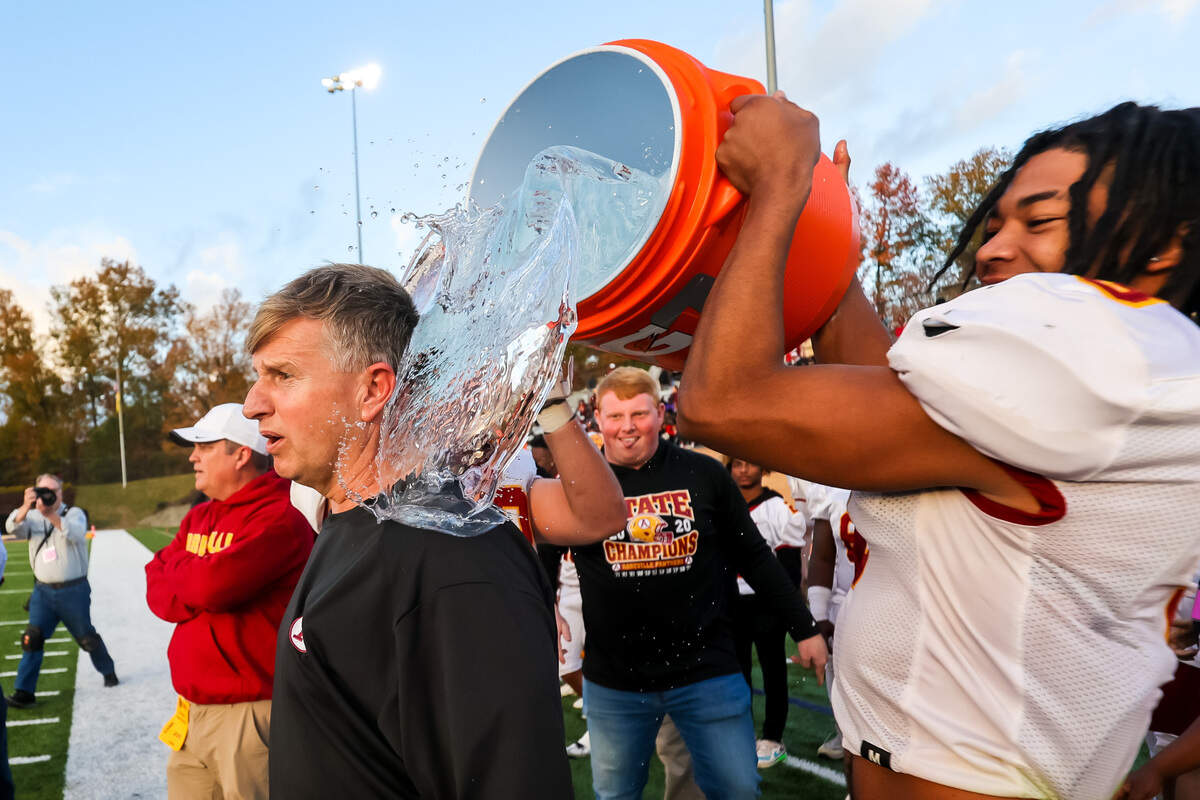 Abbeville Panthers head coach James Nickles is dunked in the closing moments of their victory over the Oceanside Collegiate Landsharks during the AA State Championship game at Benedict College in Columbia, SC.