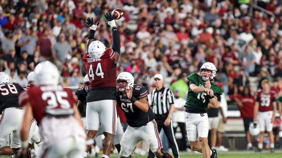South Carolina’s Monkell Goodwine leaps to defend a Cutter Woods pass in the 2025 spring football game at Williams-Brice Stadium.