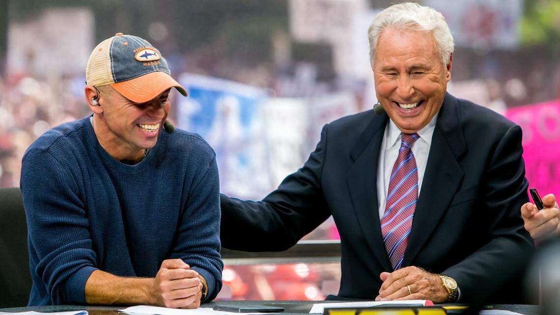 Kenny Chesney and Lee Corso chat during ESPN’s College GameDay broadcast from the University of South Carolina’s Horseshoe in 2014.