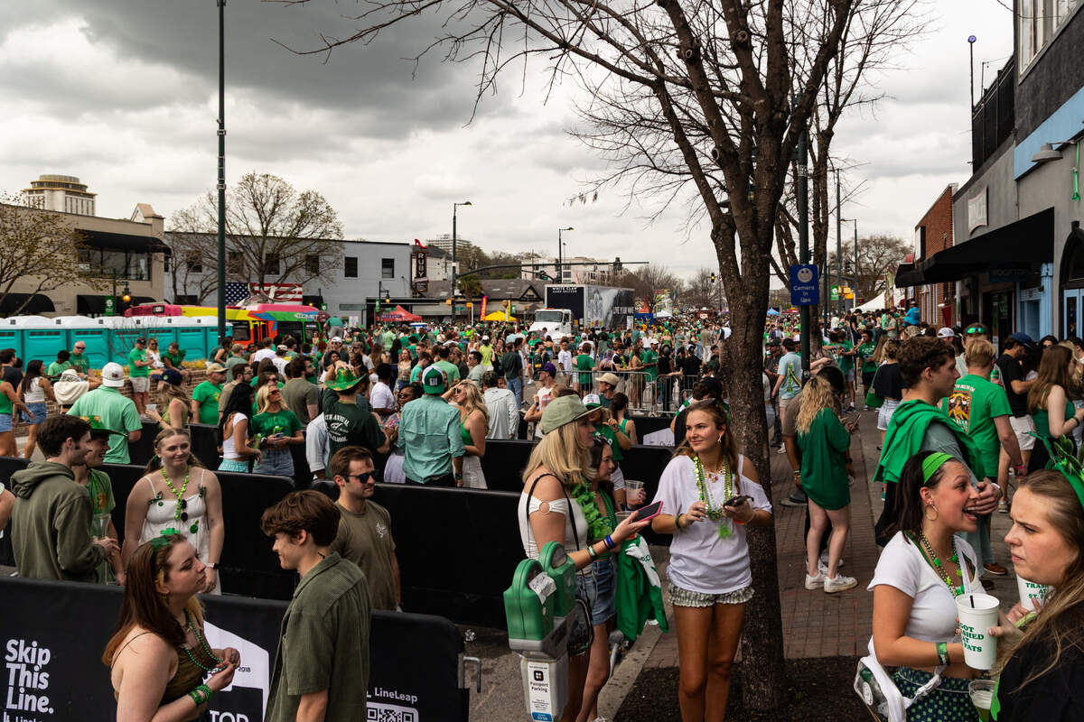 People wait in line to enter Rooftop Bar during the St. Pat’s in Five Points festival in Columbia, South Carolina on Saturday, March 15, 2025.