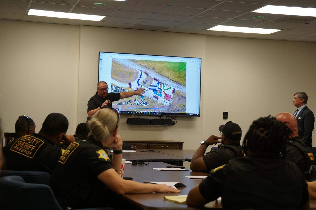 Law enforcement officers from the Richland County Sheriff’s Department, Columbia Police Department and Forest Acres Police Department listen to a briefing in advance of the Dept. of Correction’s Contraband Sting on Nov. 8, 2023.