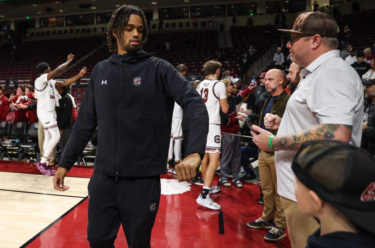 South Carolina guard Cam Scott (23) is greeted by fans following the men's basketball game against North Carolina A&T at Colonial Life Arena on Tuesday, Nov. 4, 2025.