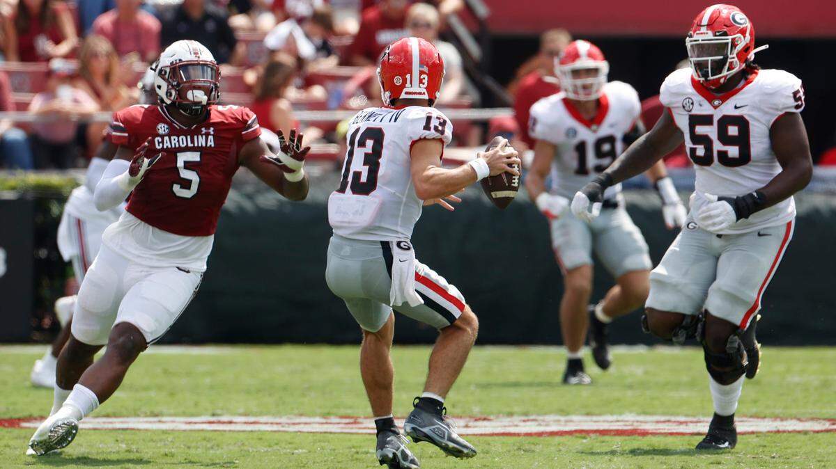 South Carolina Gamecocks defender Jordan Burch (5) attempts to get to Georgia Bulldogs quarterback Stetson Bennett (13) at Williams-Brice Stadium on Saturday, September 17, 2022.