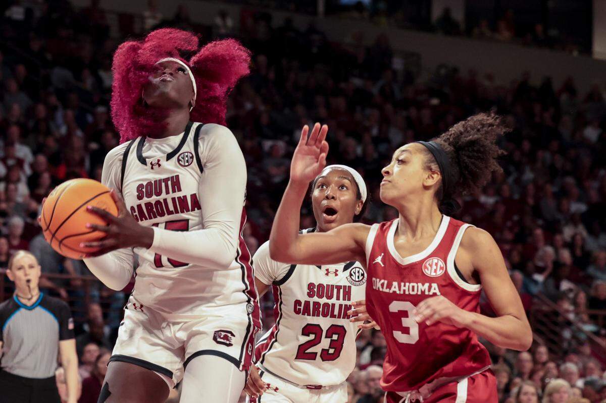 University of South Carolina’s Adhel Tac (15) looks to shoot as Oklahoma’s Zya Vann (3) pressures during the first half of action in the Colonial Life Arena on Sunday, Jan. 19, 2025.