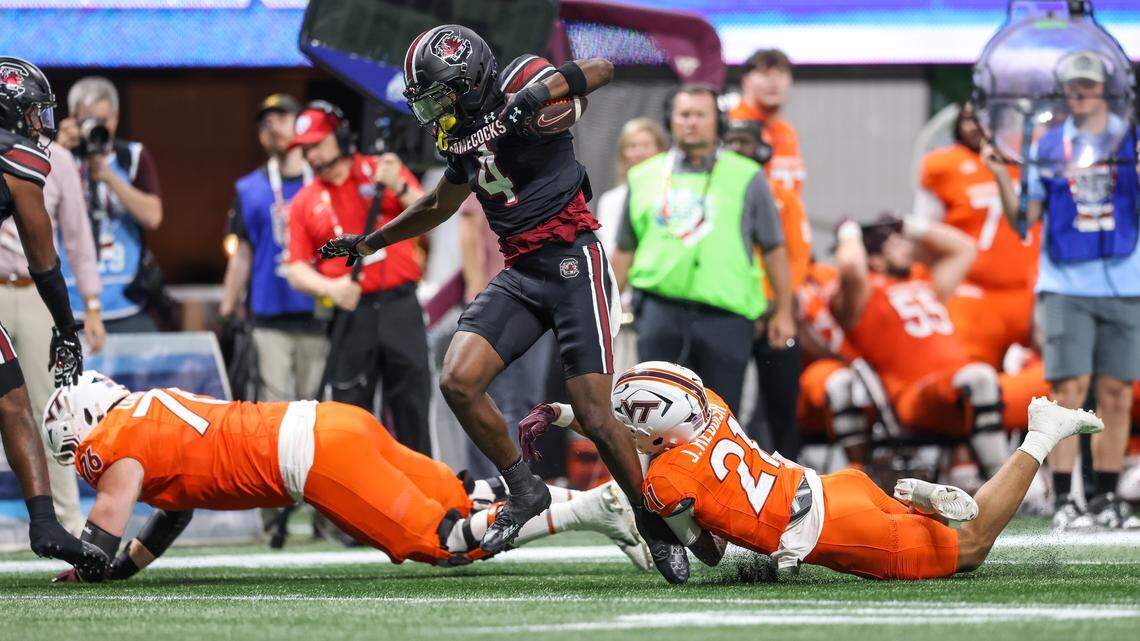 South Carolina’s Vicari Swain (4) returns a punt for a touchdown against Virginia Tech  on Sunday at Mercedes-Benz Stadium in Atlanta. 