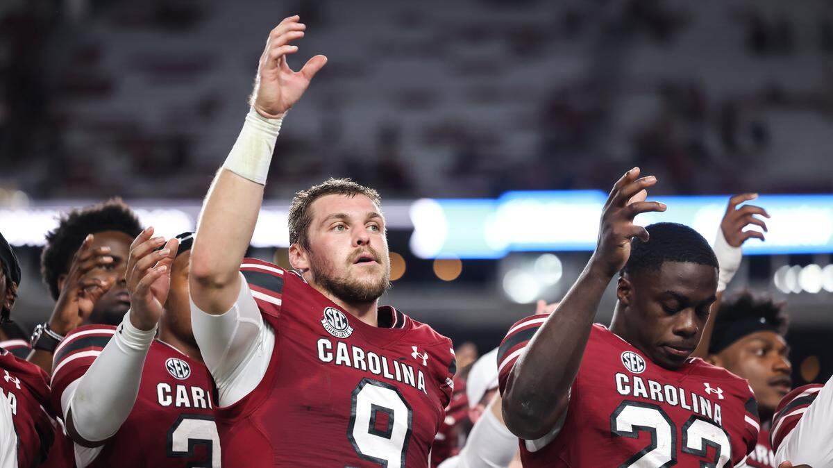 South Carolina quarterback Luke Doty (9) and running back Isaiah Augustave (23) stand for the alma mater following the Gamecocks’ game against Vanderbilt at Williams-Brice Stadium in Columbia on Saturday, September 13, 2025.