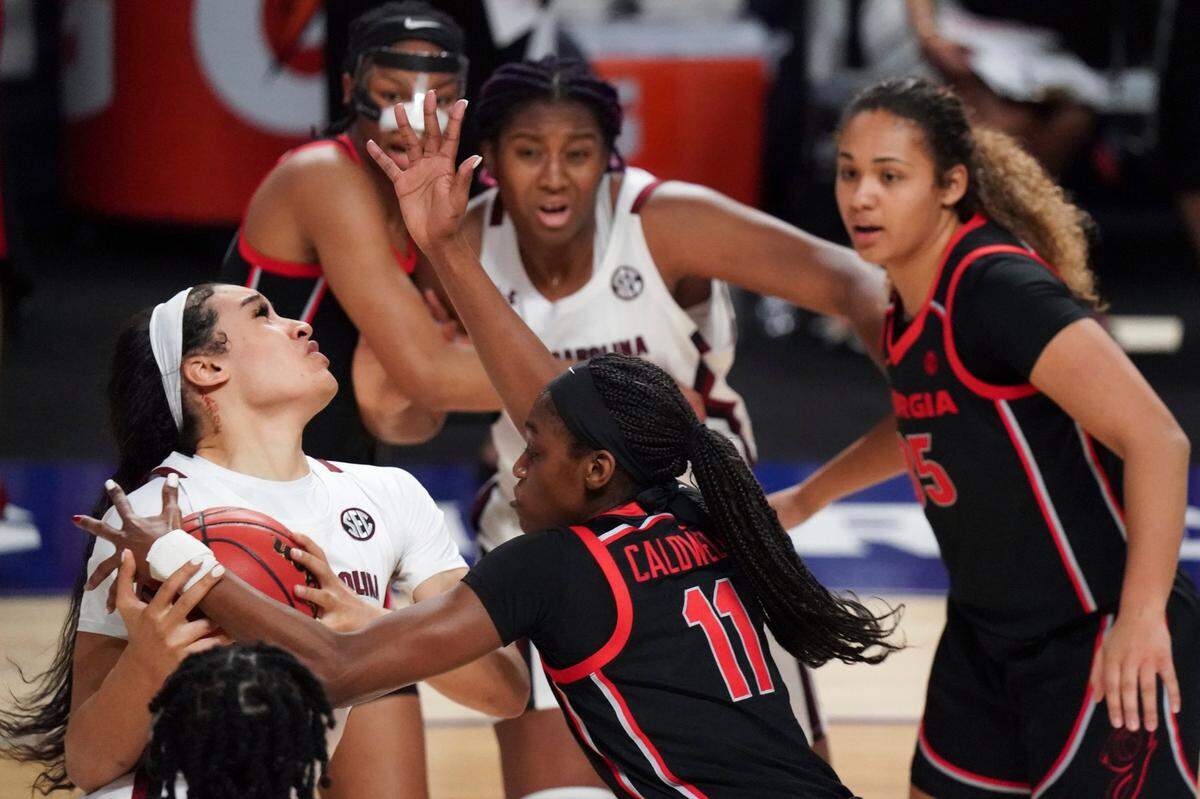 South Carolina guard Brea Beal, left, drives to the hoop against Georgia guard Maya Caldwell (11) during the first half of an NCAA college basketball game Sunday, March 7, 2021, during the Southeastern Conference tournament final in Greenville, S.C.