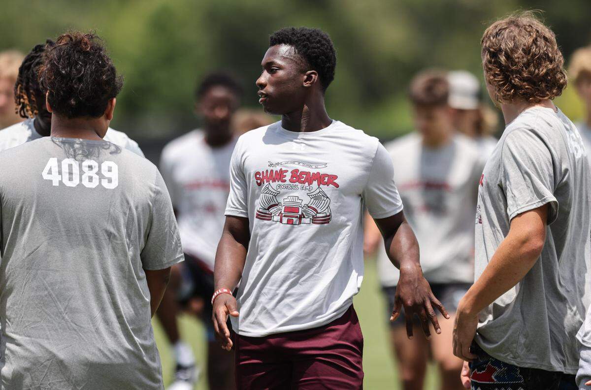 Jaquel Holman (center), from Blackville-Hilda High School, participates during the Shane Beamer Football Camp at the Spurrier Indoor Practice Facility in Columbia on Friday, May 31, 2024.
