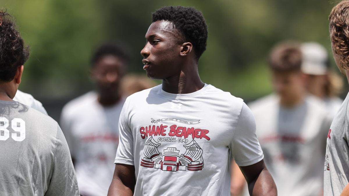 Jaquel Holman (center), from Blackville-Hilda High School, participates during the Shane Beamer Football Camp on Friday.