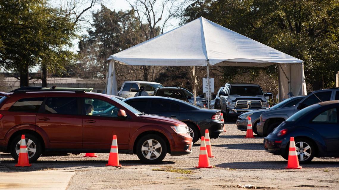 Dozens of people wait in their cars for coronavirus tests and vaccines at the Department of Health and Environmental Control on Tuesday, January 4, 2023.