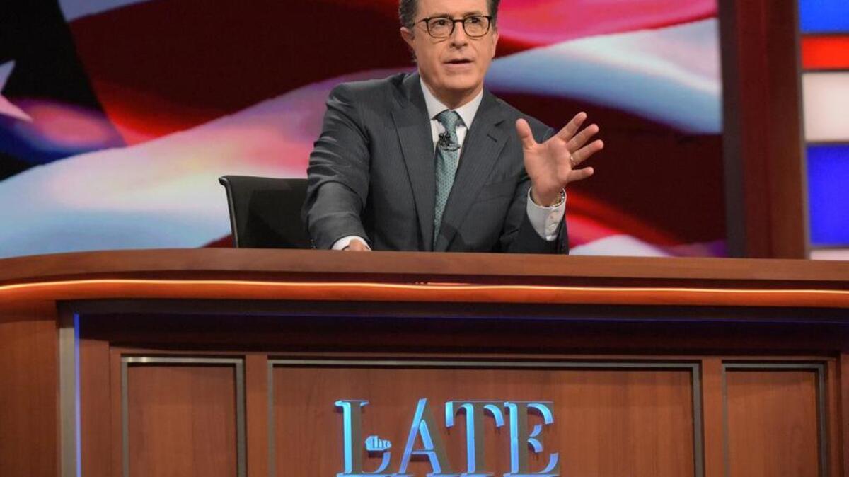 In this July 27, 2016 photo released by CBS, Stephen Colbert, host of ‘The Late Show with Stephen Colbert,’ appears during a broadcast in New York. Lawyers representing his old show company complained to CBS after Colbert revived the character he played under his own name on ‘The Colbert Report,’ a clueless, full-of-himself cable news host.