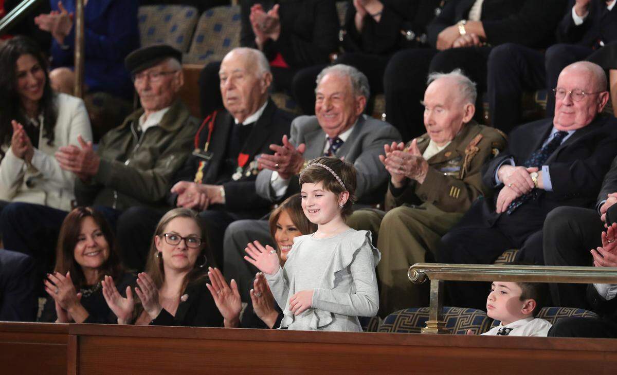 Grace Eline waves as President Donald Trump delivers his State of the Union address to a joint session of Congress on Capitol Hill in Washington, Tuesday, Feb. 5, 2019. (AP Photo/Andrew Harnik)