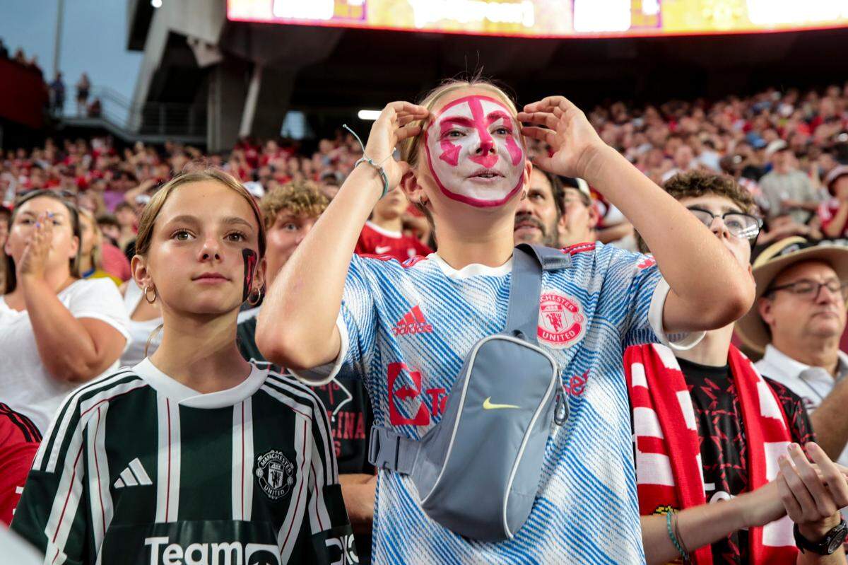 Briar Bailey, 12, left, and Larsen Stinnette, 12, of Virginia Beach, react to play as Manchester United and Liverpool play in Williams-Brice Stadium on Saturday, Aug. 3, 2024.