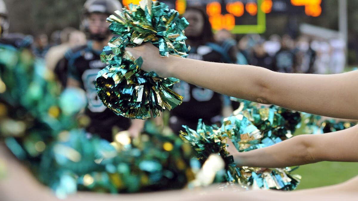 A high school cheerleading team has been suspended for inappropriate behavior.