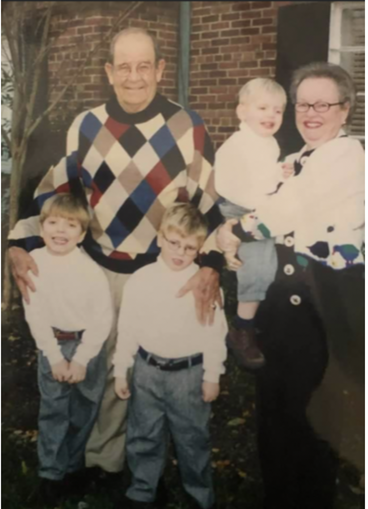Ed Crocker (left) and his wife, Jan, pose for a photo with three of their seven grandkids (from left to right) Ben, Will and Robert Portnoy in Washington, D.C.