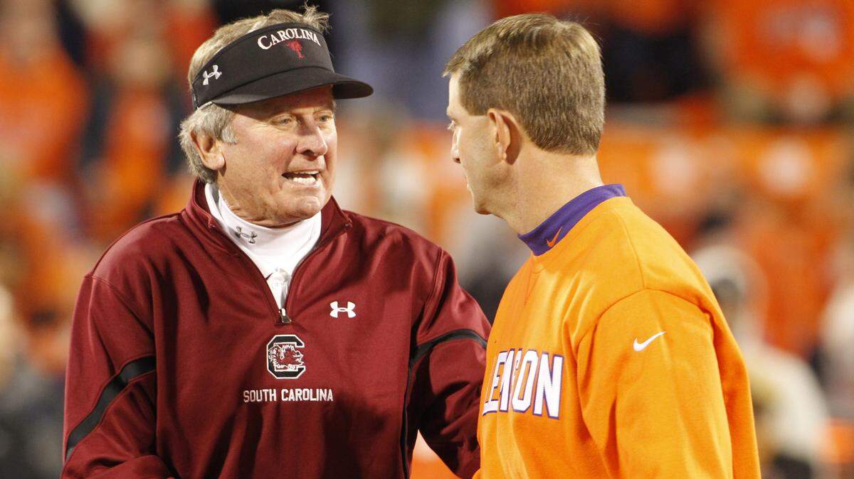 South Carolina head coach Steve Spurrier and Clemson head coach Dabo Swinney shake hands and chat prior to their game at Memorial Stadium in Clemson, SC.