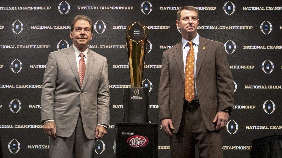 From Jan. 6, 2018: Clemson head coach Dabo Swinney, right, and Alabama coach Nick Saban pose for photos after a press conference for the College Football Playoff national championship.