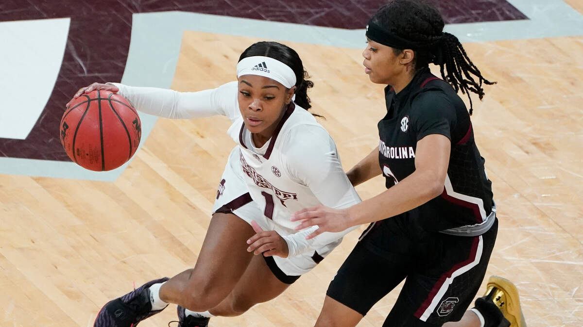 Mississippi State guard Myah Taylor (1) dribbles past South Carolina guard Destanni Henderson (3) during the first half of an NCAA college basketball game in Starkville, Miss., Thursday, Jan. 28, 2021. South Carolina won 75-52. (AP Photo/Rogelio V. Solis)