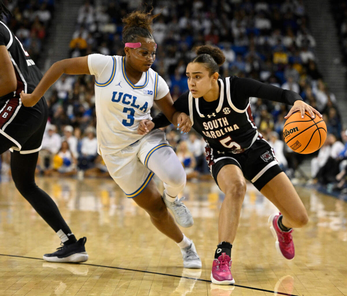 South Carolina Gamecocks guard Tessa Johnson (5) drives to the basket defended by UCLA Bruins guard Londynn Jones (3) during the third quarter at Pauley Pavilion.