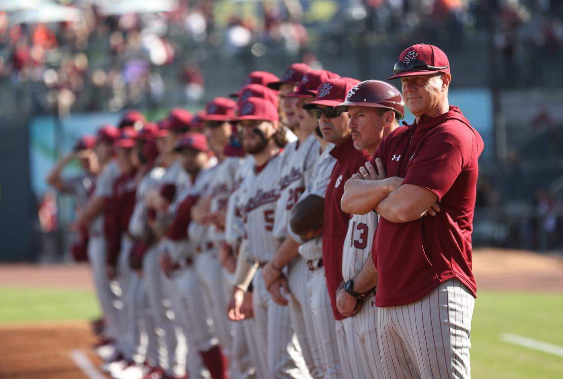 South Carolina head coach Mark Kingston stands with his team before the Gamecocks’ game against Clemson at Segra Park in Columbia on Saturday, March 2, 2024.