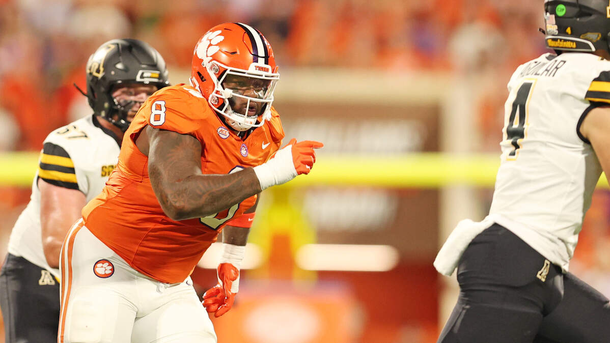 Clemson defensive tackle Tre Williams (8) chases after Appalachian State quarterback Joey Aguilar (4) in Clemson, S.C. on Saturday, Sept. 7, 2024.