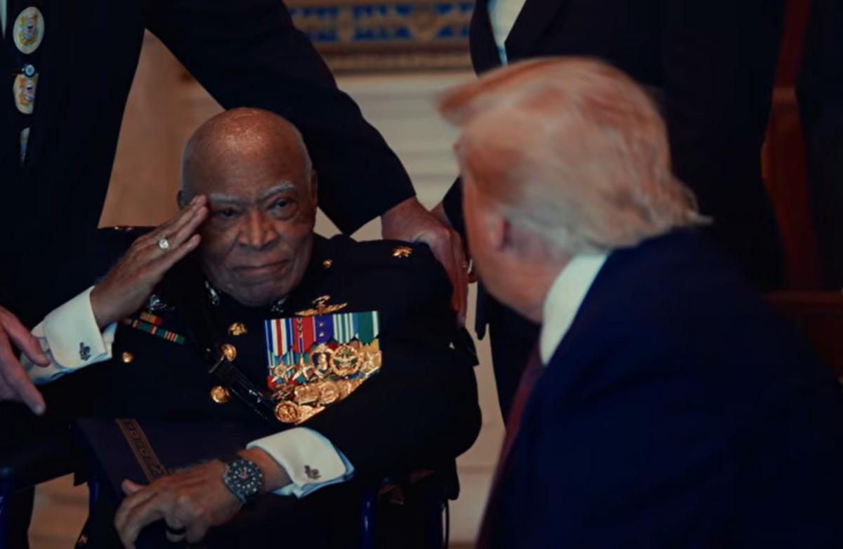 Maj. James Capers salutes during a meeting with President Donald Trump during a trip to the White House to receive the Medal of Honor.