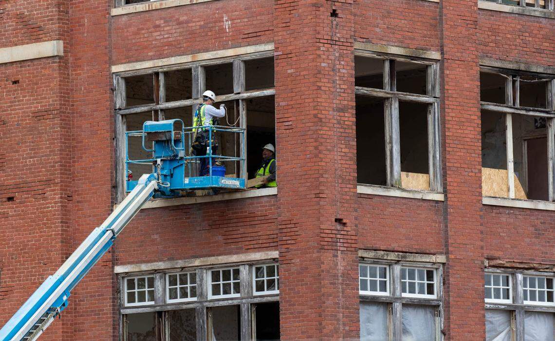 Crews work on the renovation of the Babcock Building on the BullStreet Development The historic mental hospital is being reconstructed as a luxury apartment building. The iconic cupola that fell during a fire in 2020 will be replaced.
