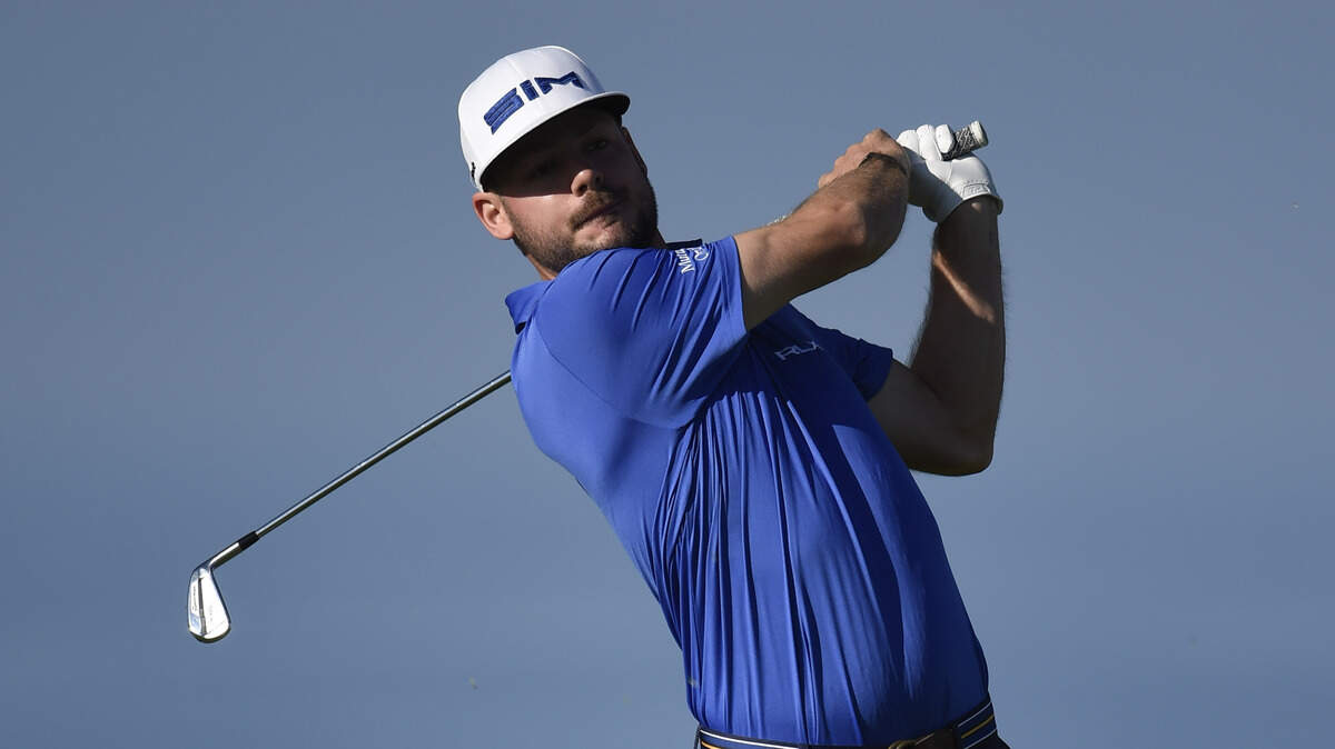 Doc Redman hits his tee shot on the 11th hole of the North Course at Torrey Pines Golf Course during the first round of the Farmers Insurance golf tournament Thursday Jan. 23, 2020, in San Diego. (AP Photo/Denis Poroy)