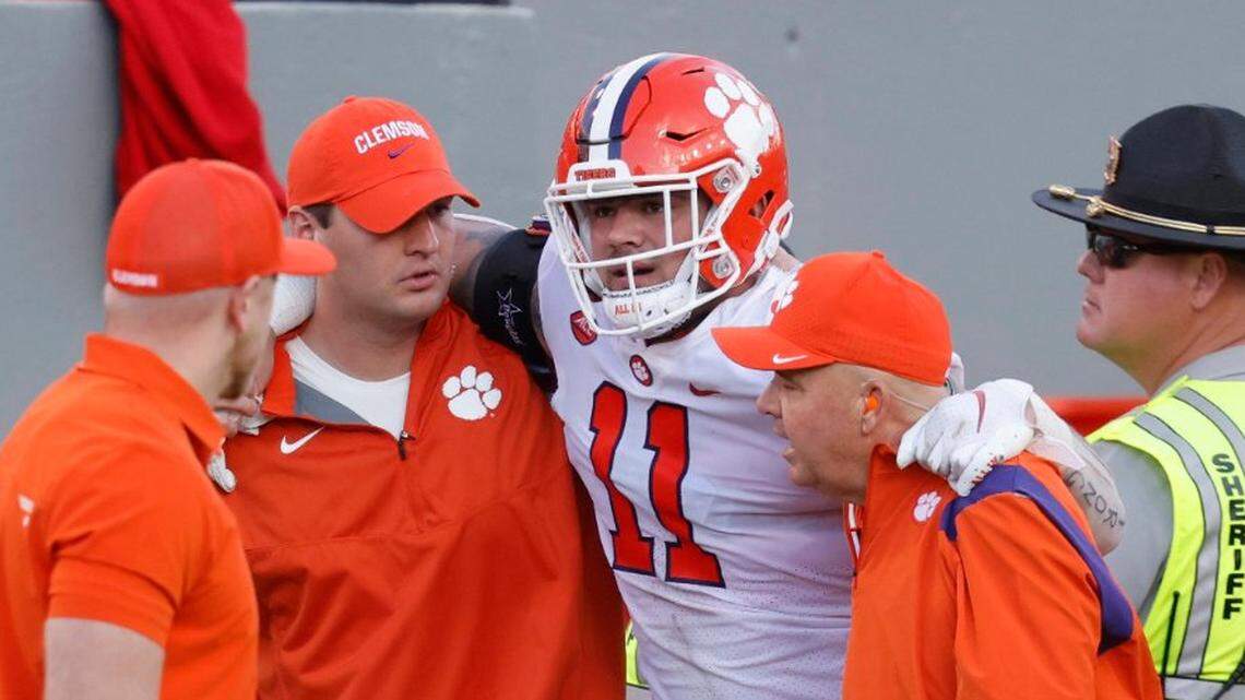 Clemson defensive lineman Bryan Bresee (11) is helped after being injured during N.C. States 27-21 overtime victory over Clemson at Carter-Finley Stadium in Raleigh, N.C., Saturday, Sept. 25, 2021.