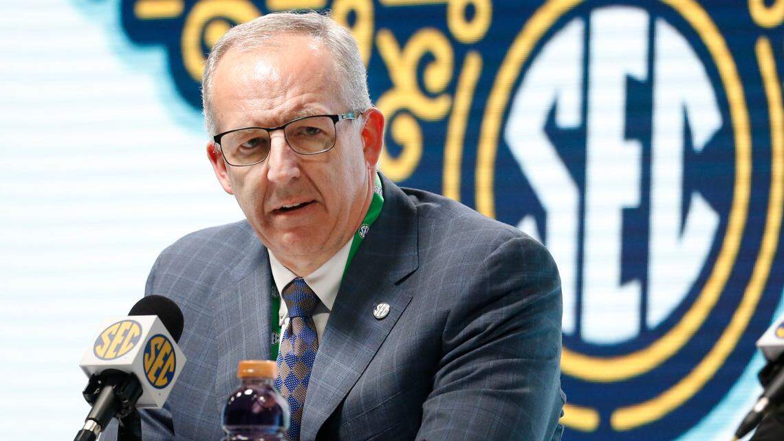 FILE - In this March 11, 2020, file photo, Southeastern Conference Commissioner Greg Sankey announces that fans will not be allowed in the arena to watch NCAA college basketball games in the SEC tournament in Nashville, Tenn.