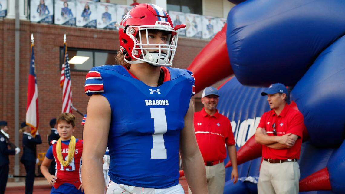 Jefferson’s Sammy Brown (1) leads Jefferson on the field before the start of a GHSA high school football game against Clarke Central in Jefferson, Ga., on Friday, Sept. 22, 2023.