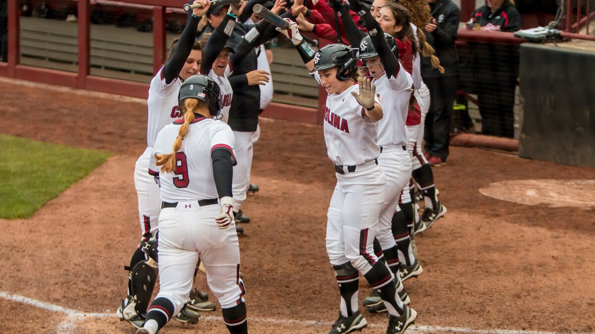 South Carolina Gamecocks Cayla Drotar (9) is greeted at home after hitting a three-run homer against the St. John’s Red Storm at Carolina Softball Stadium at Beckham Field.