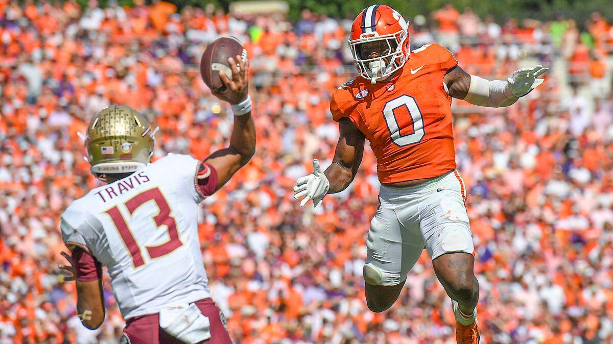 Clemson Tigers linebacker Barrett Carter (0) pressures Florida State Seminoles quarterback Jordan Travis (13) during the fourth quarter at Memorial Stadium.