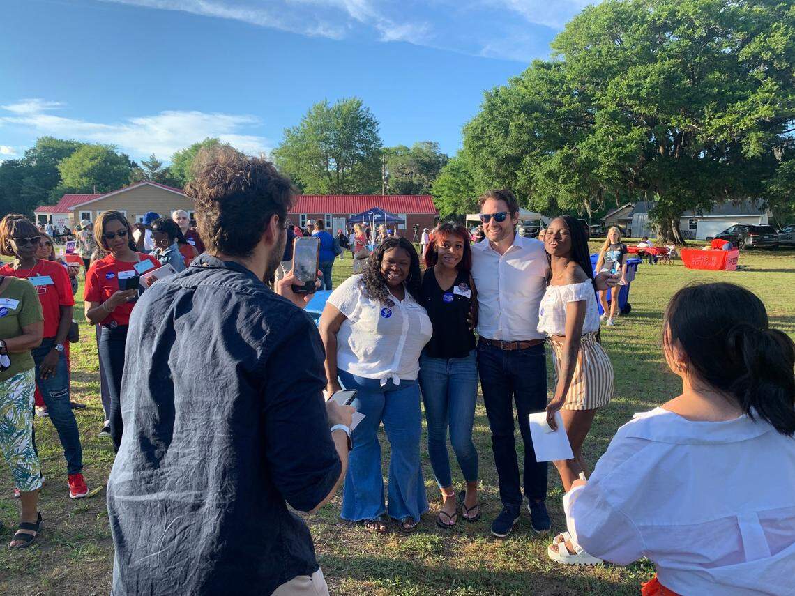 Former U.S. Rep. Joe Cunningham, a Democratic candidate for South Carolina governor, poses for a photo at the annual fish fry hosted by House Majority Whip Jim Clyburn in North Charleston on Saturday, May 7, 2022.