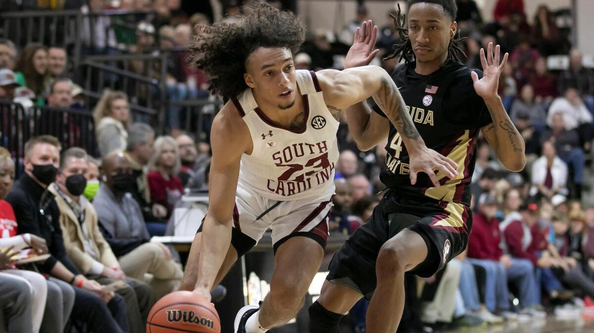 Devin Carter of USC drives past Caleb Mills of Florida State during the Gamecocks’ game against the Seminoles in the No Room For Racism Classic in Rock Hill on Sunday, December 12, 2021.