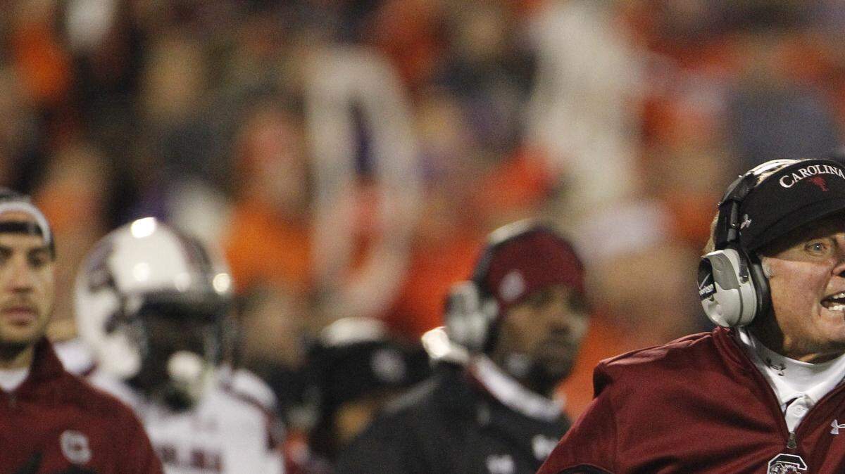 South Carolina head coach Steve Spurrier yells out instructions in the third quarter of their game at Memorial Stadium in Clemson, SC.
