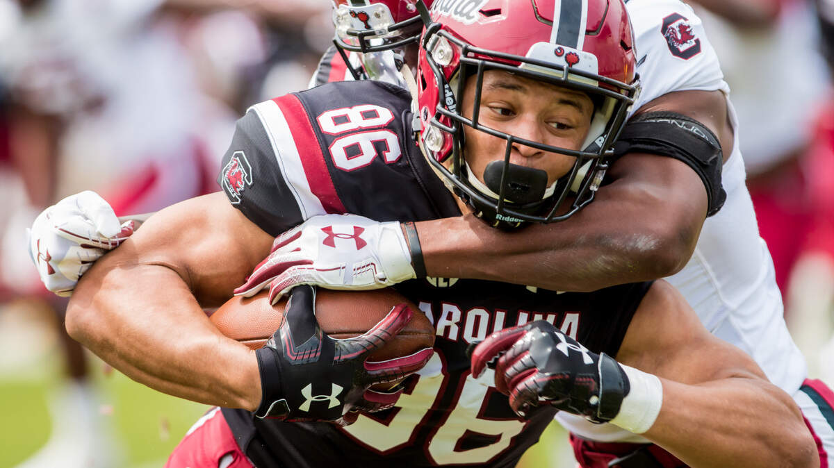 South Carolina Gamecocks wide receiver Chad Terrell (86) is brought down by South Carolina Gamecocks defensive back Jaycee Horn (7) during the annual 2019 spring game at Williams-Brice Stadium.