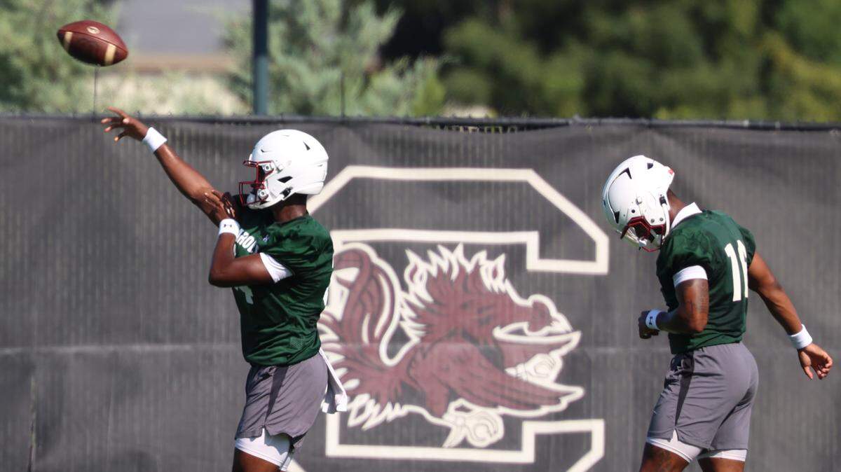 Brandon Cunningham, left, runs drills with LaNorris Sellers during the University of South Carolina’s first football practice of the 2025 season on Friday, Aug. 1, 2025.