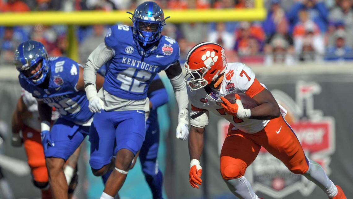Clemson running back Phil Mafah (7) runs near Kentucky linebacker Luke Fulton (40) during the second quarter of the TaxSlayer Gator Bowl at EverBank Stadium in Jacksonville Beach, Florida, Friday, December 29, 2023.