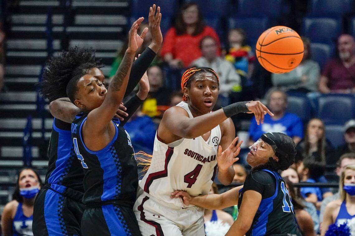 South Carolina’s Aliyah Boston (4) passes the ball away from Kentucky’s Dre’una Edwards, left, and Jada Walker (11) in the first half of the NCAA women’s college basketball Southeastern Conference tournament championship game Sunday, March 6, 2022, in Nashville, Tenn. (AP Photo/Mark Humphrey)