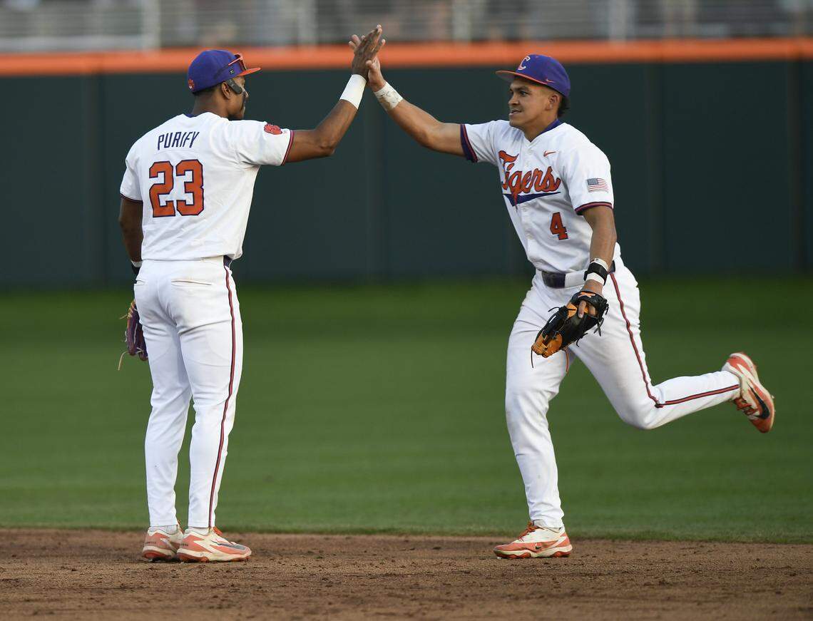 Clemson’s Jarren Purify (23) and Tryston McCladdie (4) celebrate after the Tigers win over South Carolina Sunday, March 1, 2026 at Clemson’s Doug Kingsmore Stadium.