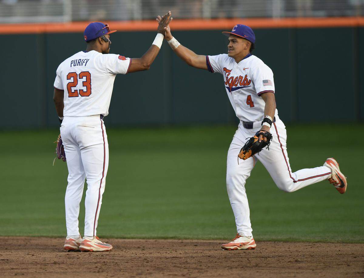Clemson’s Jarren Purify (23) and Tryston McCladdie (4) celebrate after the Tigers win over South Carolina Sunday, March 1, 2026 at Clemson’s Doug Kingsmore Stadium.