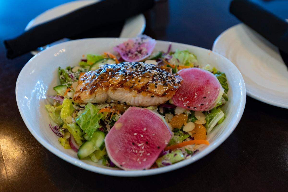 The grilled sesame salmon is a new entree at Iron Hill Brewery & Restaurant in the Bull Street District. The Philly based chain opened in the district in 2023.